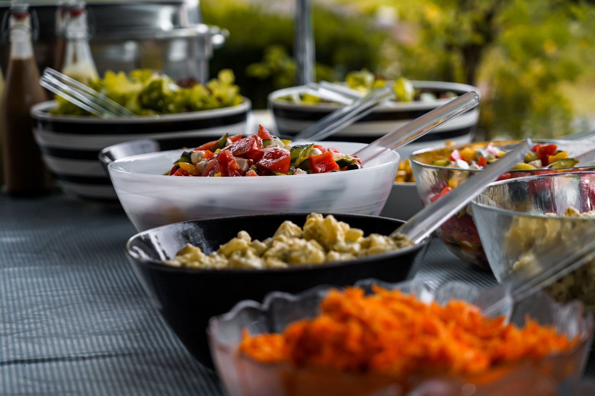 Try not to overindulge at buffets. (Image via Unsplash/ Tim Meyer)